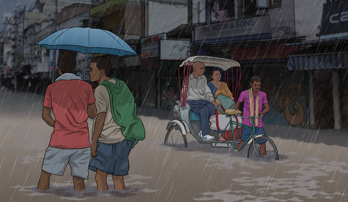 People in India traversing through flooded streets during Monsoon